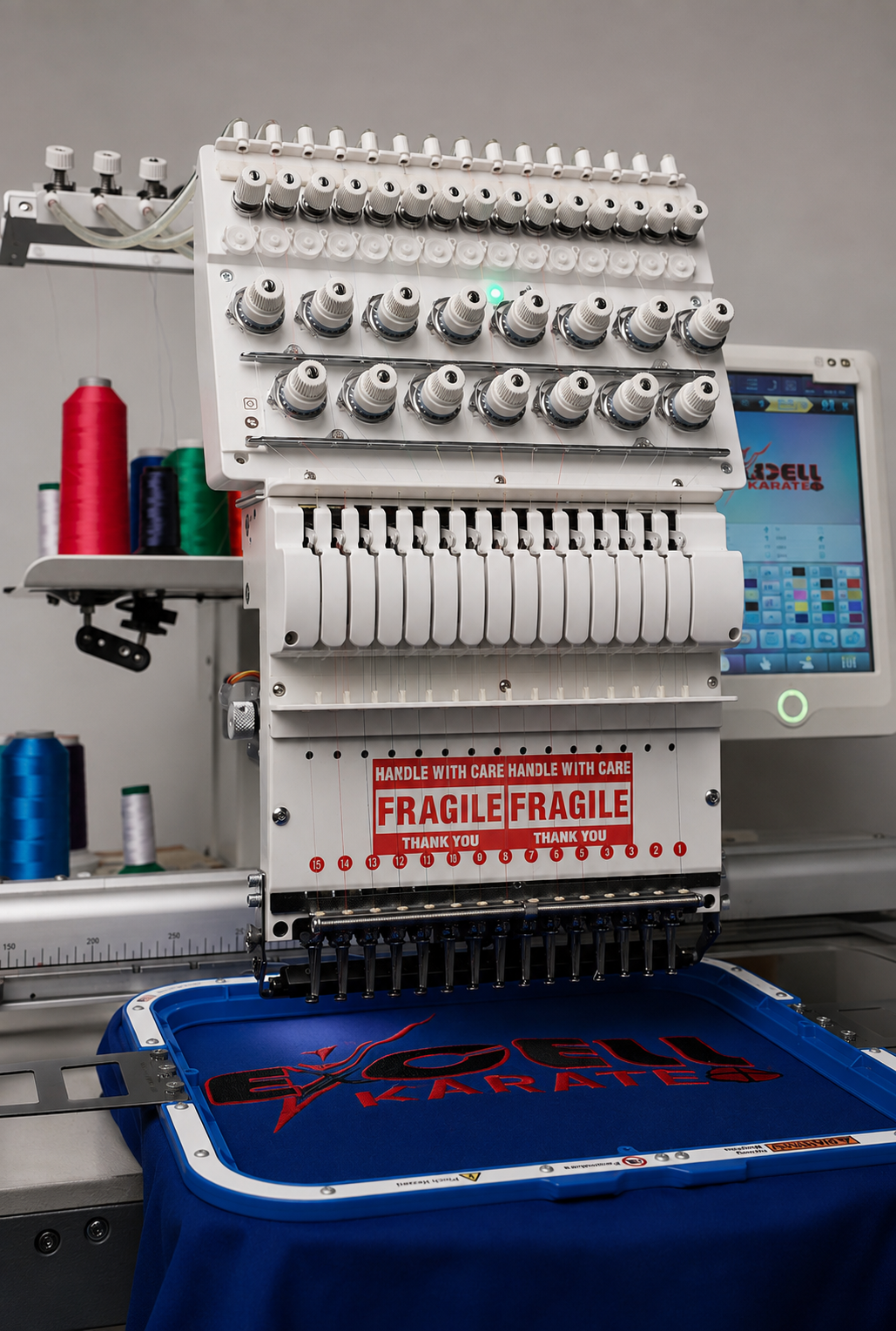 Multi-needle embroidery machine stitching a custom patch